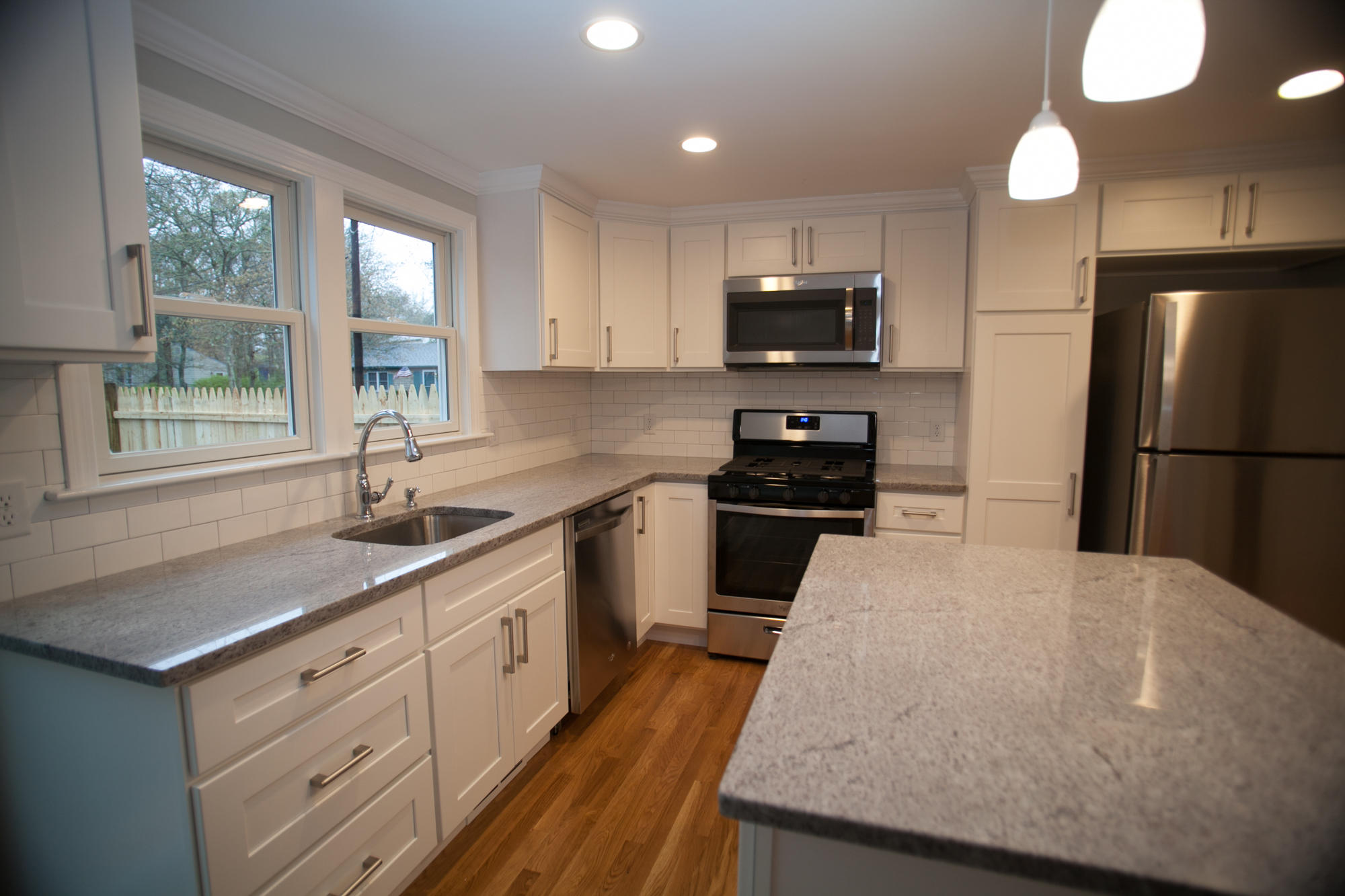 235 Old Craigville Road Hyannis, MA 02601 - Photo 9 of 35 a kitchen with a sink a stove and refrigerator