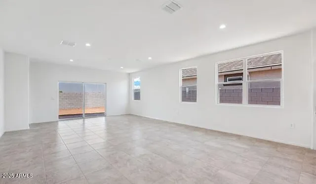 a bathroom with a granite countertop sink a mirror and shower