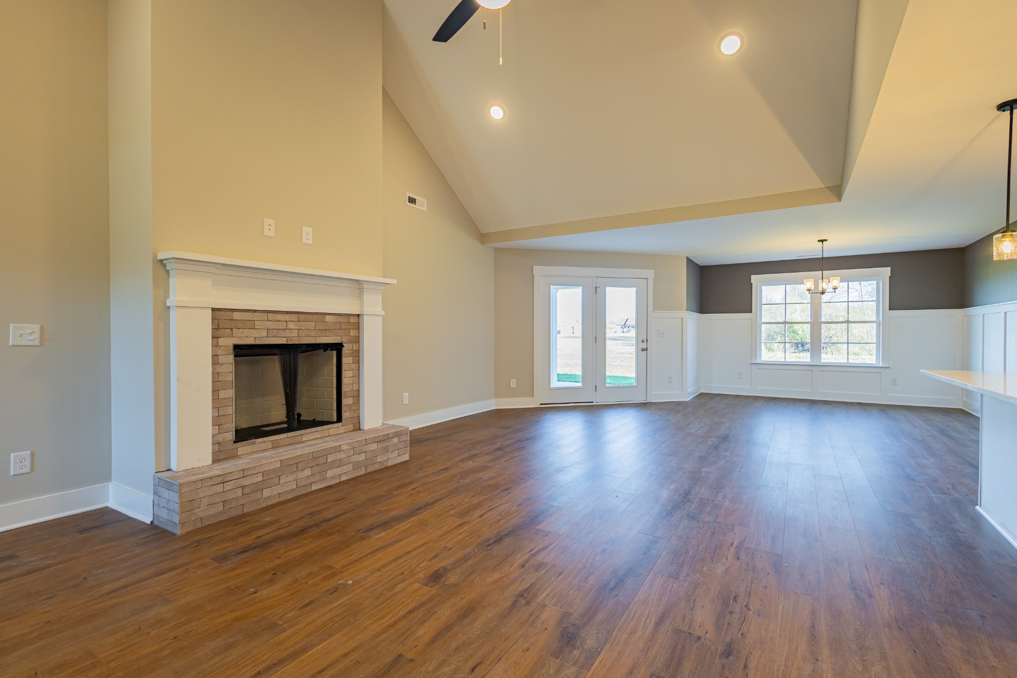 71 Brooklyn Avenue Manchester, TN 37355 - Photo 13 of 69 an empty room with wooden floor and fireplace