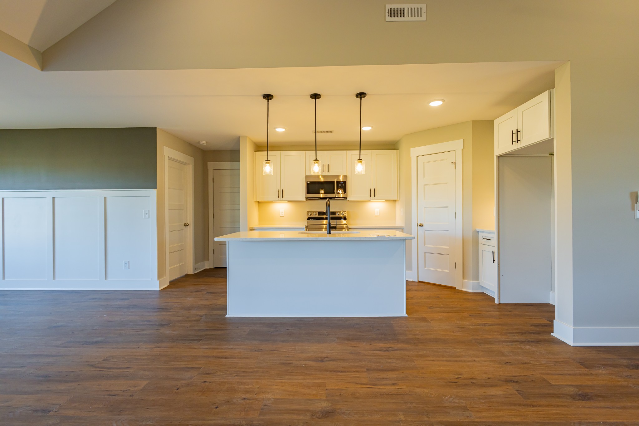 71 Brooklyn Avenue Manchester, TN 37355 - Photo 19 of 69 a view of kitchen with kitchen island a sink wooden floor and a refrigerator