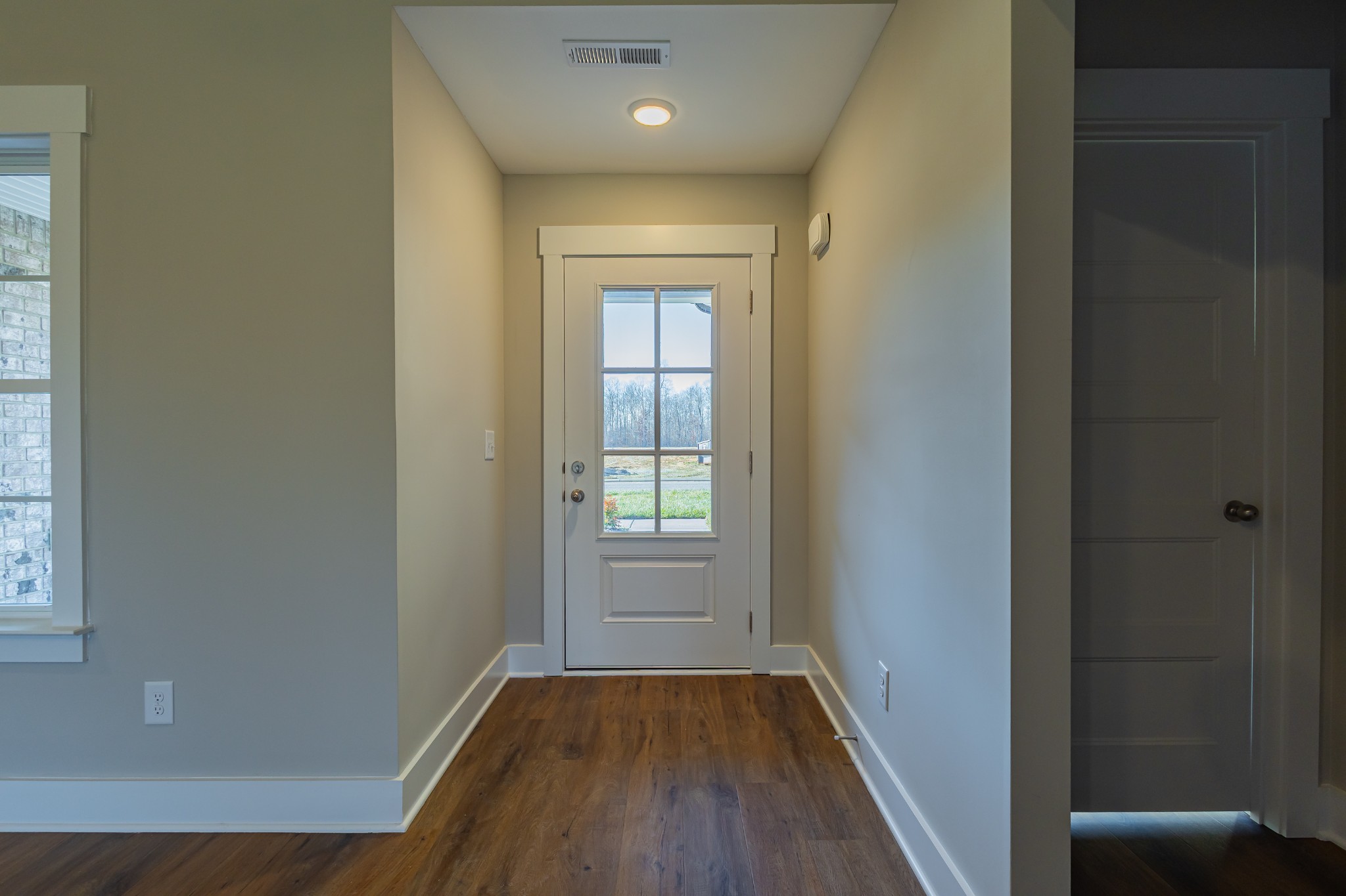 71 Brooklyn Avenue Manchester, TN 37355 - Photo 20 of 69 a view of hallway with window and wooden floor