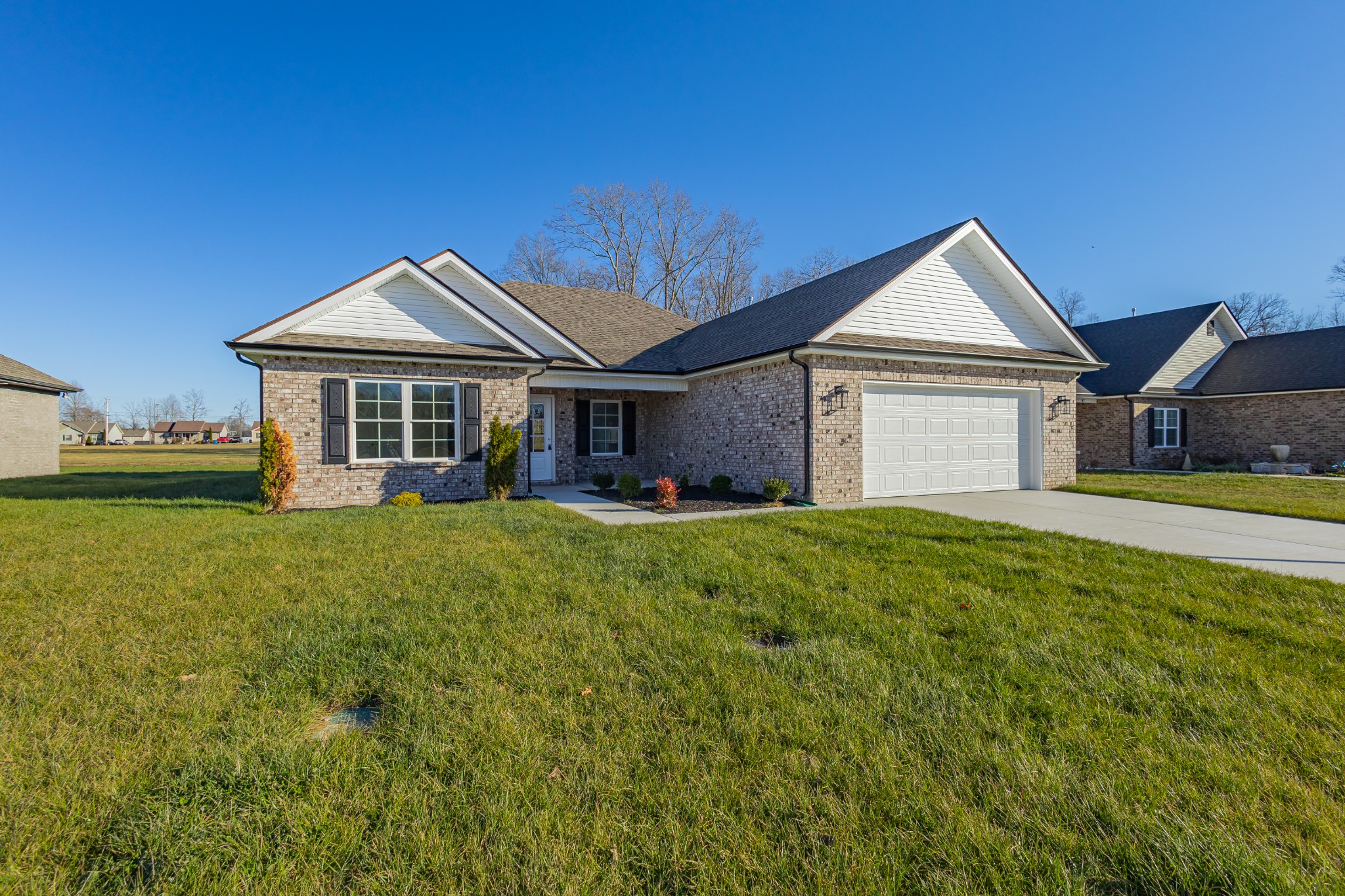 71 Brooklyn Avenue Manchester, TN 37355 - Photo 2 of 69 a front view of a house with a yard