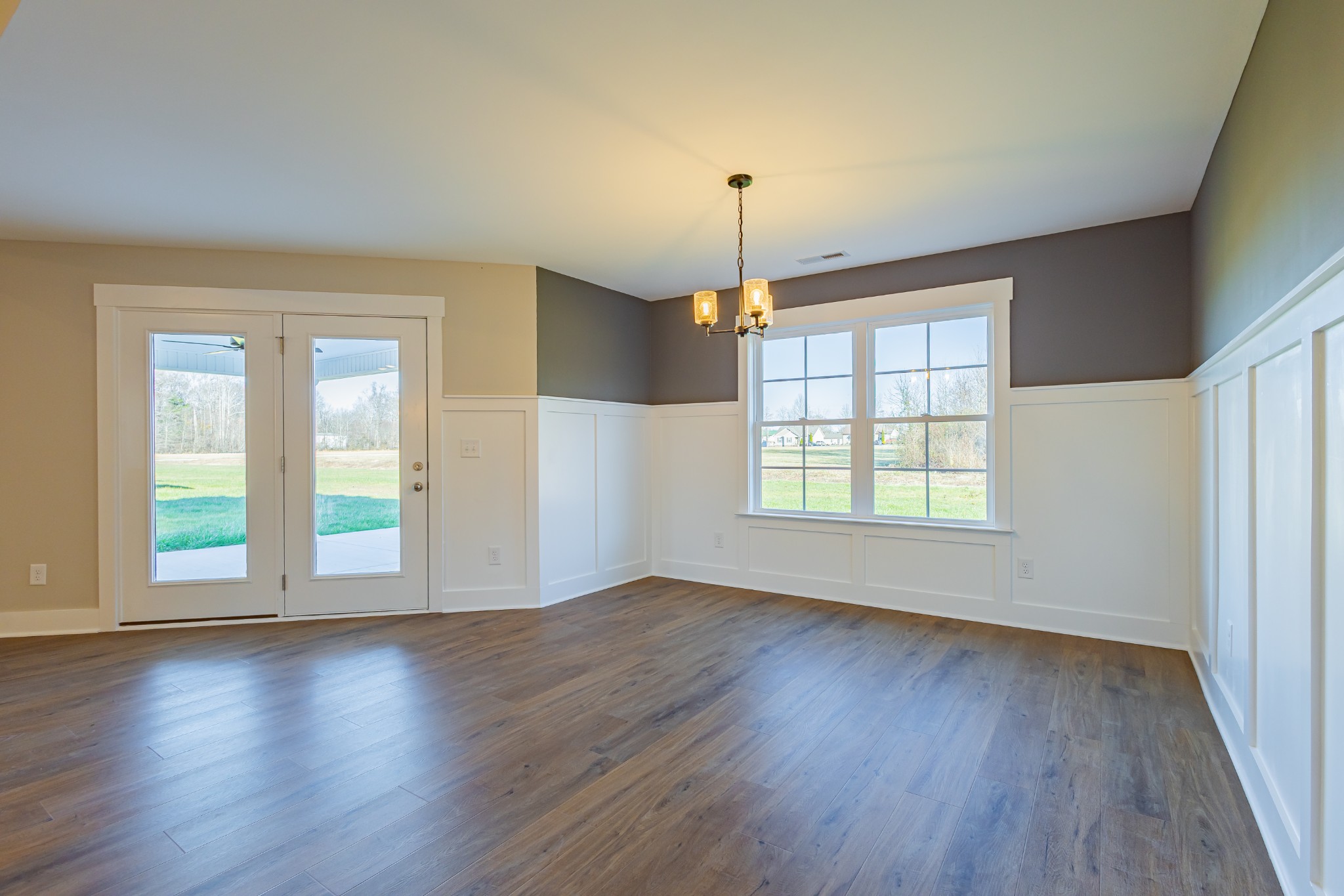 71 Brooklyn Avenue Manchester, TN 37355 - Photo 29 of 69 an empty room with wooden floor and windows