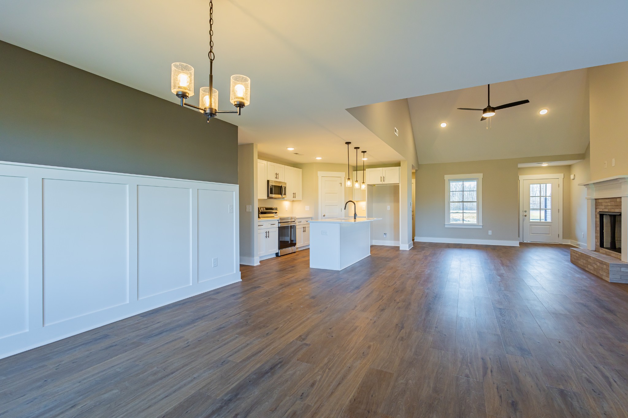 71 Brooklyn Avenue Manchester, TN 37355 - Photo 31 of 69 a view of a big room with wooden floor and windows