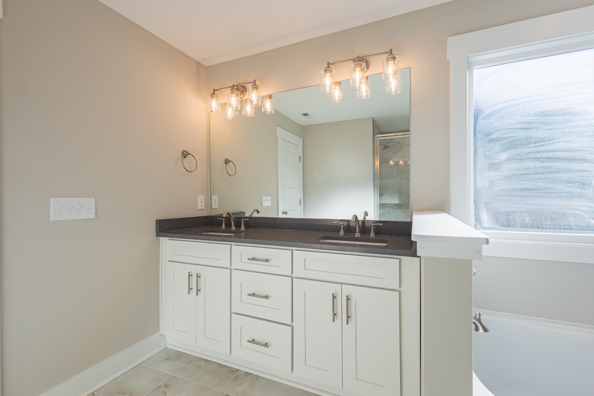 71 Brooklyn Avenue Manchester, TN 37355 - Photo 40 of 69 a bathroom with double sink and a mirror