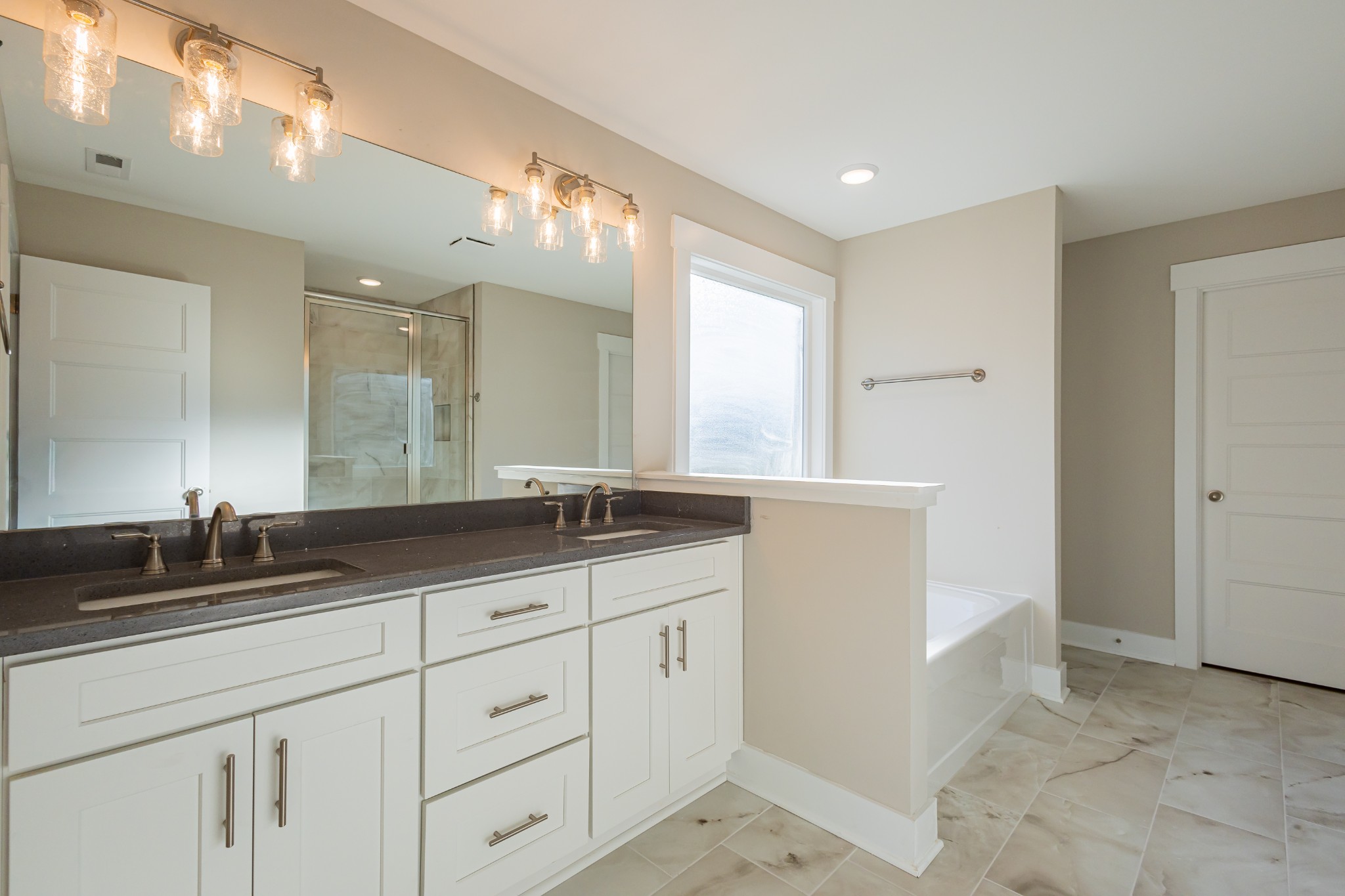 71 Brooklyn Avenue Manchester, TN 37355 - Photo 41 of 69 a bathroom with double sink and a mirror