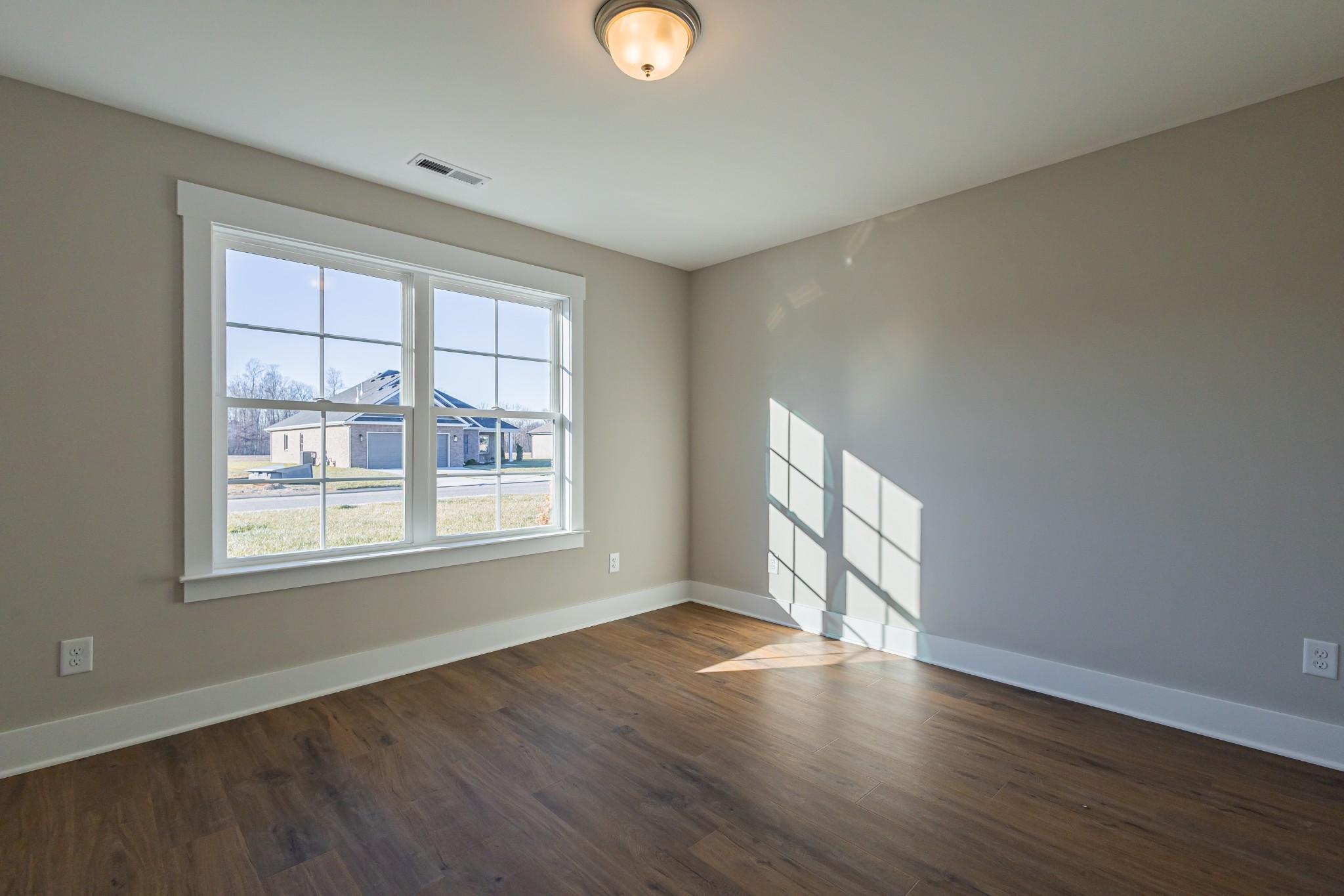 71 Brooklyn Avenue Manchester, TN 37355 - Photo 50 of 69 an empty room with wooden floor and windows
