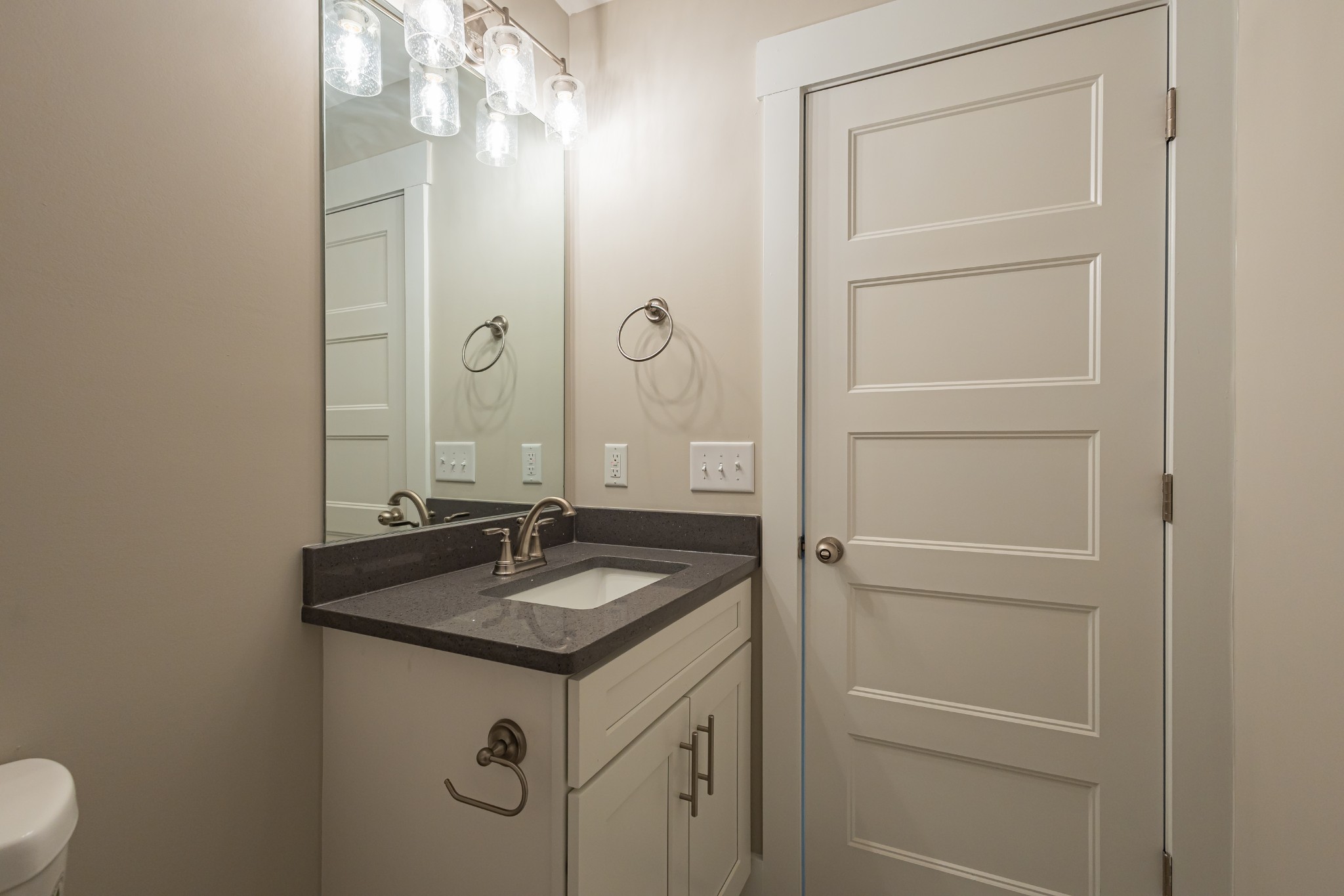 71 Brooklyn Avenue Manchester, TN 37355 - Photo 55 of 69 a bathroom with a granite countertop sink and a mirror