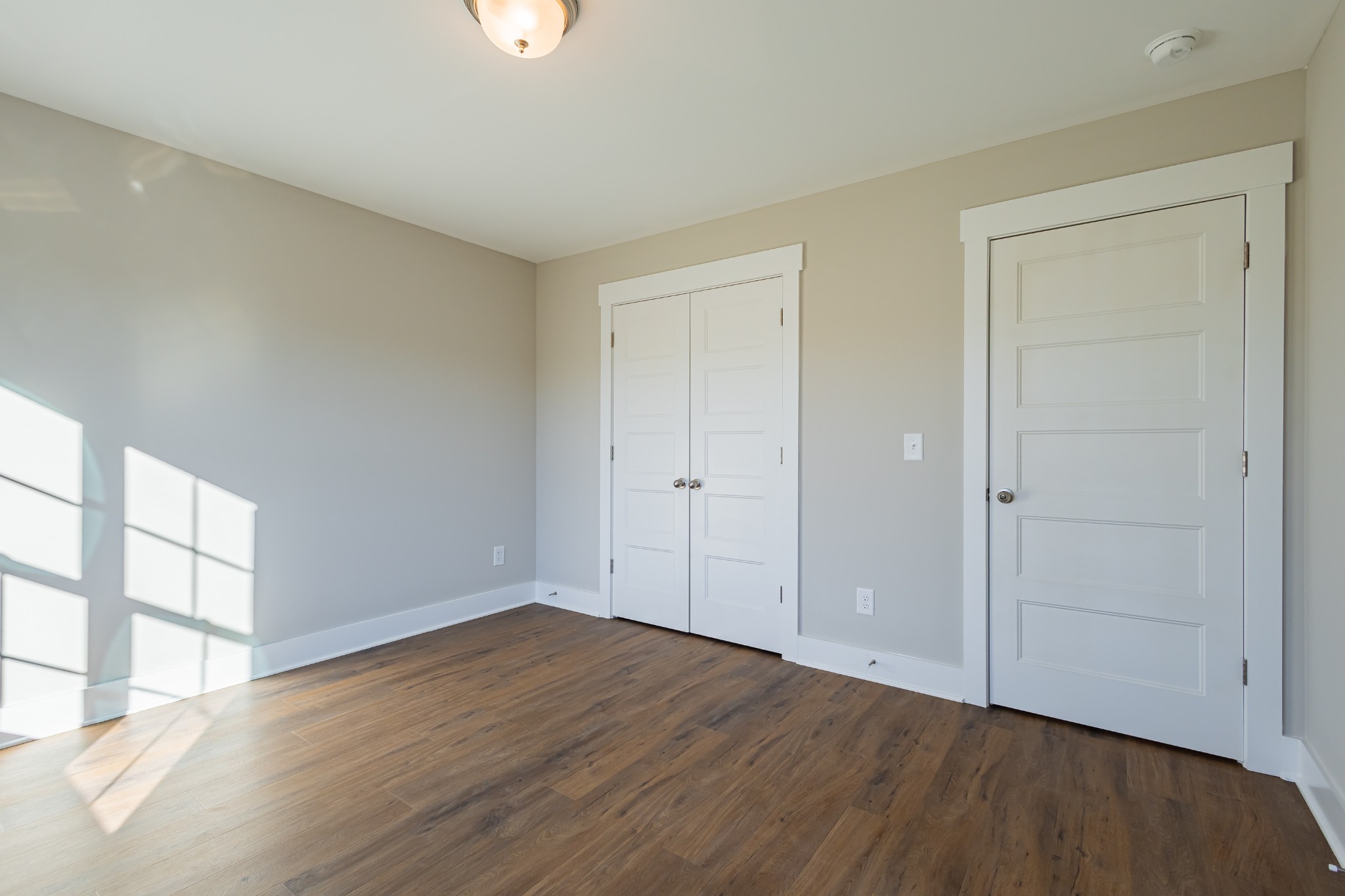 71 Brooklyn Avenue Manchester, TN 37355 - Photo 57 of 69 a view of an empty room with wooden floor and a window