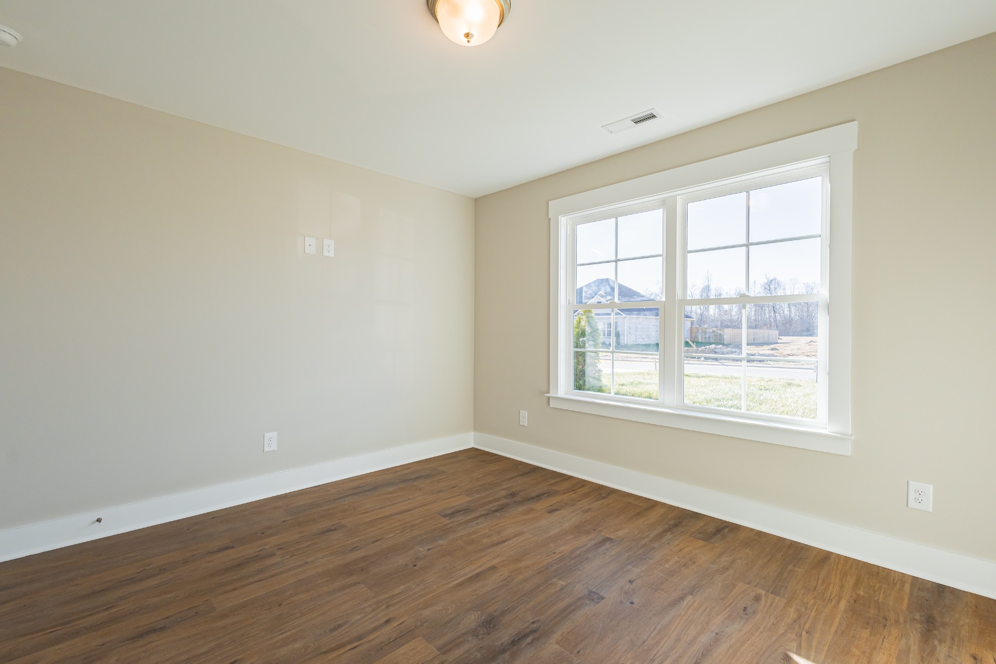 71 Brooklyn Avenue Manchester, TN 37355 - Photo 58 of 69 an empty room with wooden floor and windows
