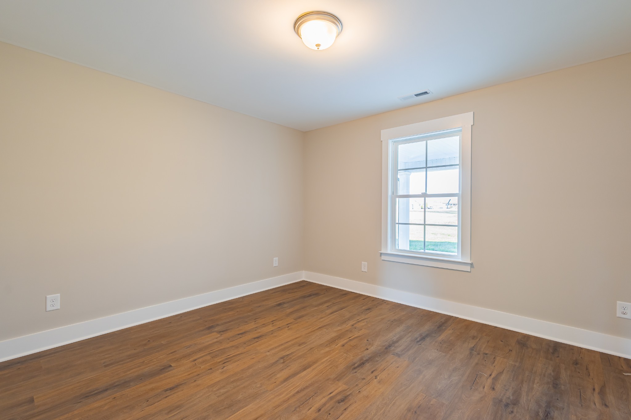 71 Brooklyn Avenue Manchester, TN 37355 - Photo 63 of 69 an empty room with wooden floor and windows