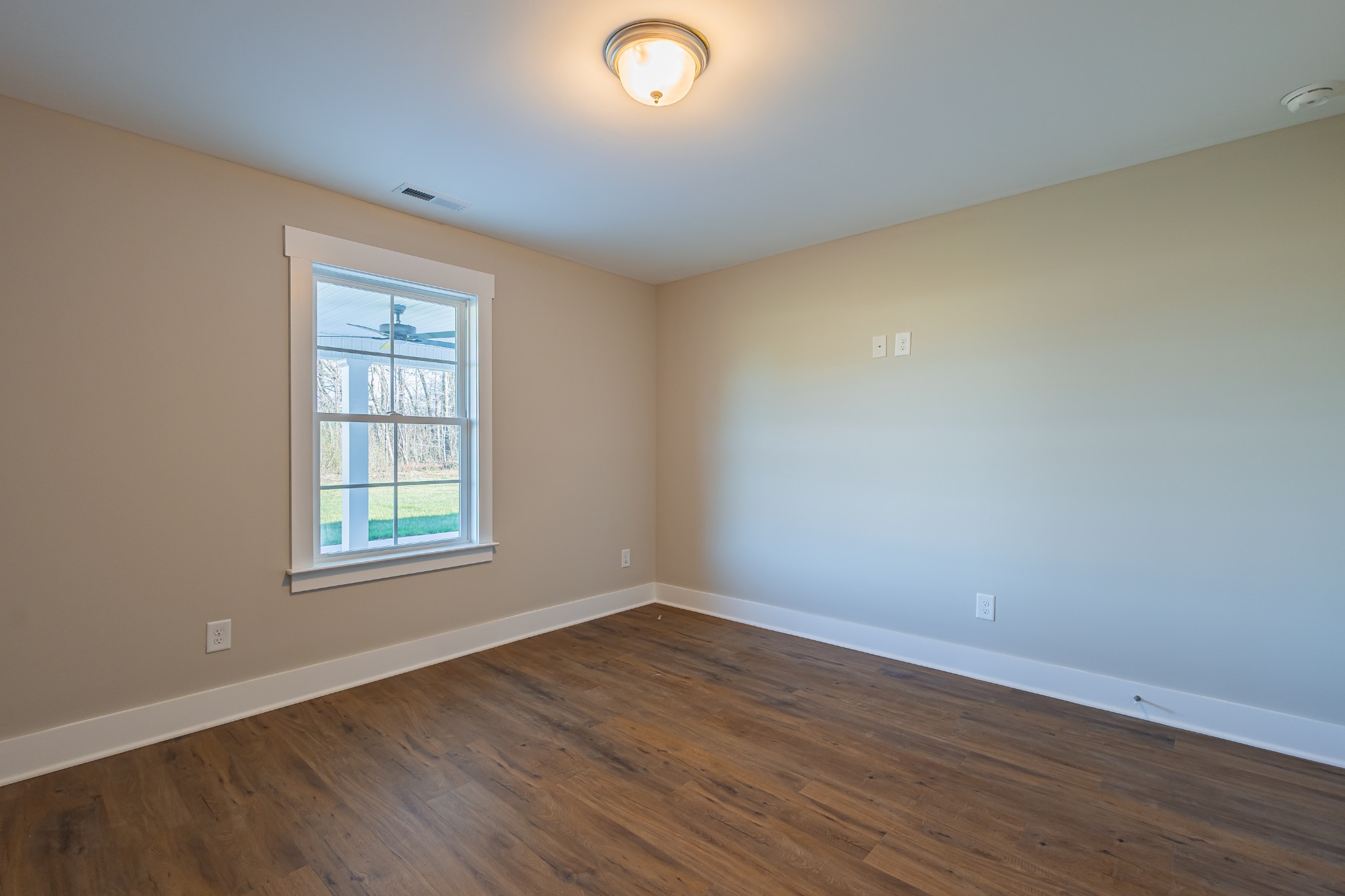 71 Brooklyn Avenue Manchester, TN 37355 - Photo 64 of 69 an empty room with wooden floor and windows