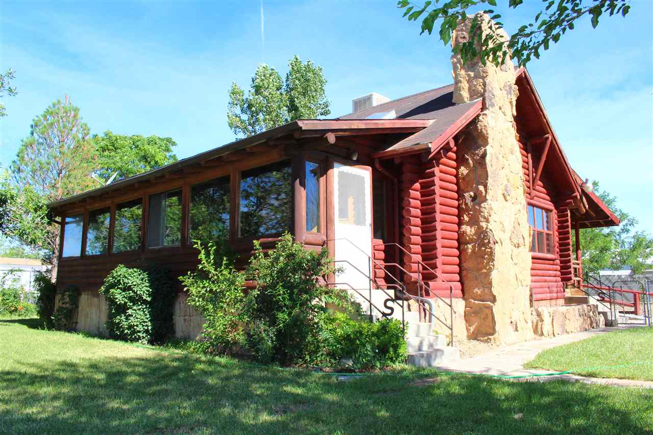 3244 D Road Clifton, CO 81520 - Photo 1 of 21 a view of a house with a yard and plants