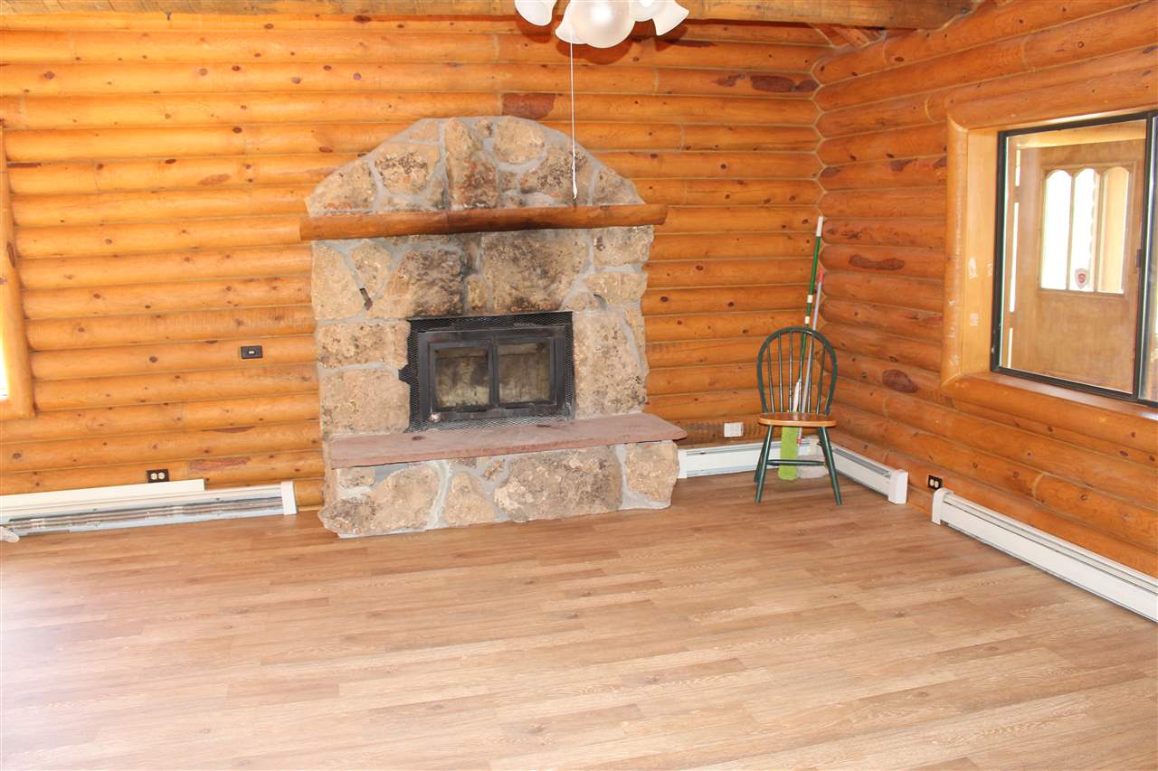 3244 D Road Clifton, CO 81520 - Photo 11 of 21 a view of a livingroom with a fireplace and window
