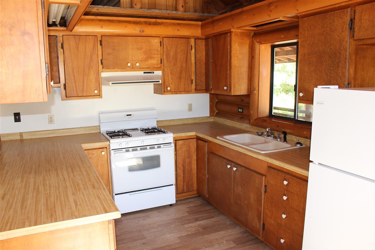 3244 D Road Clifton, CO 81520 - Photo 19 of 21 a kitchen with a stove a sink and a refrigerator