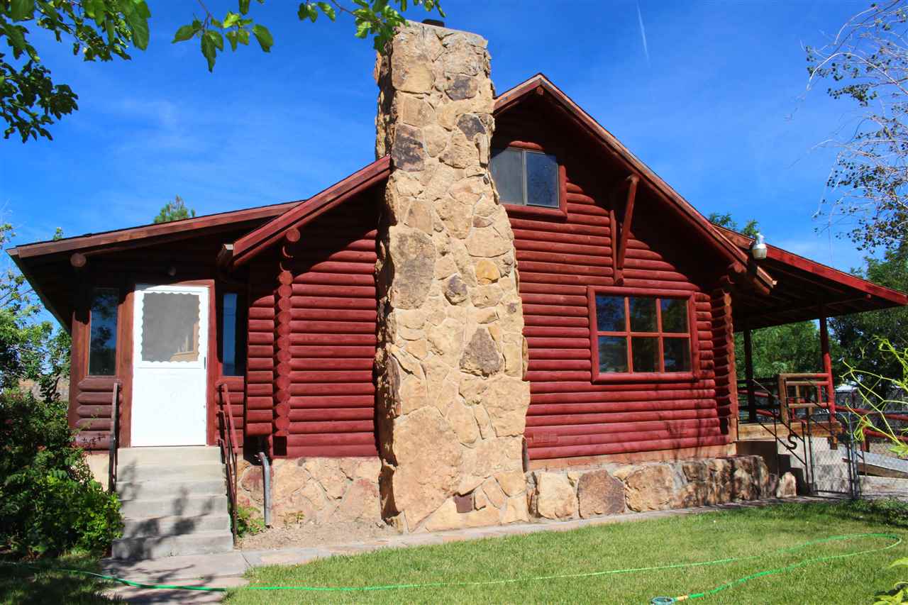 3244 D Road Clifton, CO 81520 - Photo 2 of 21 a front view of house with yard