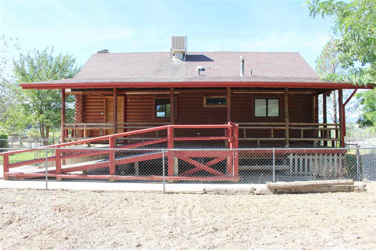 3244 D Road Clifton, CO 81520 - Photo 3 of 21 a view of a house with a window and wooden fence