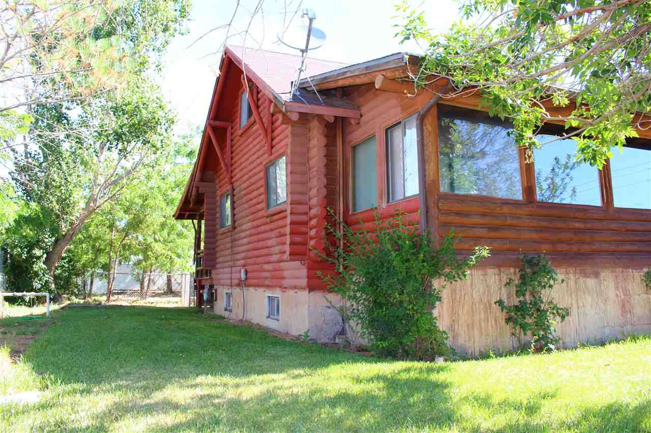 3244 D Road Clifton, CO 81520 - Photo 4 of 21 a front view of a house with a garden