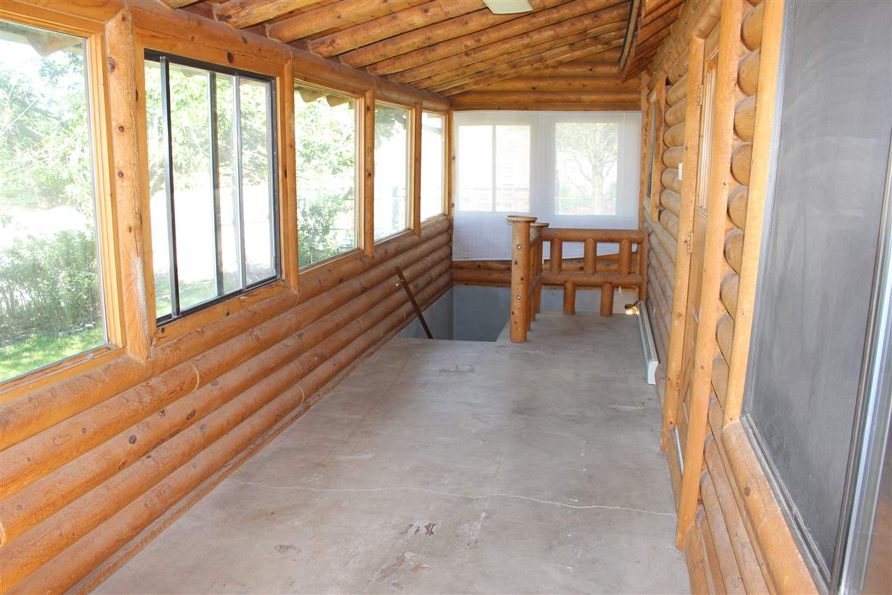 3244 D Road Clifton, CO 81520 - Photo 8 of 21 a view of a large room with wooden floor and furniture