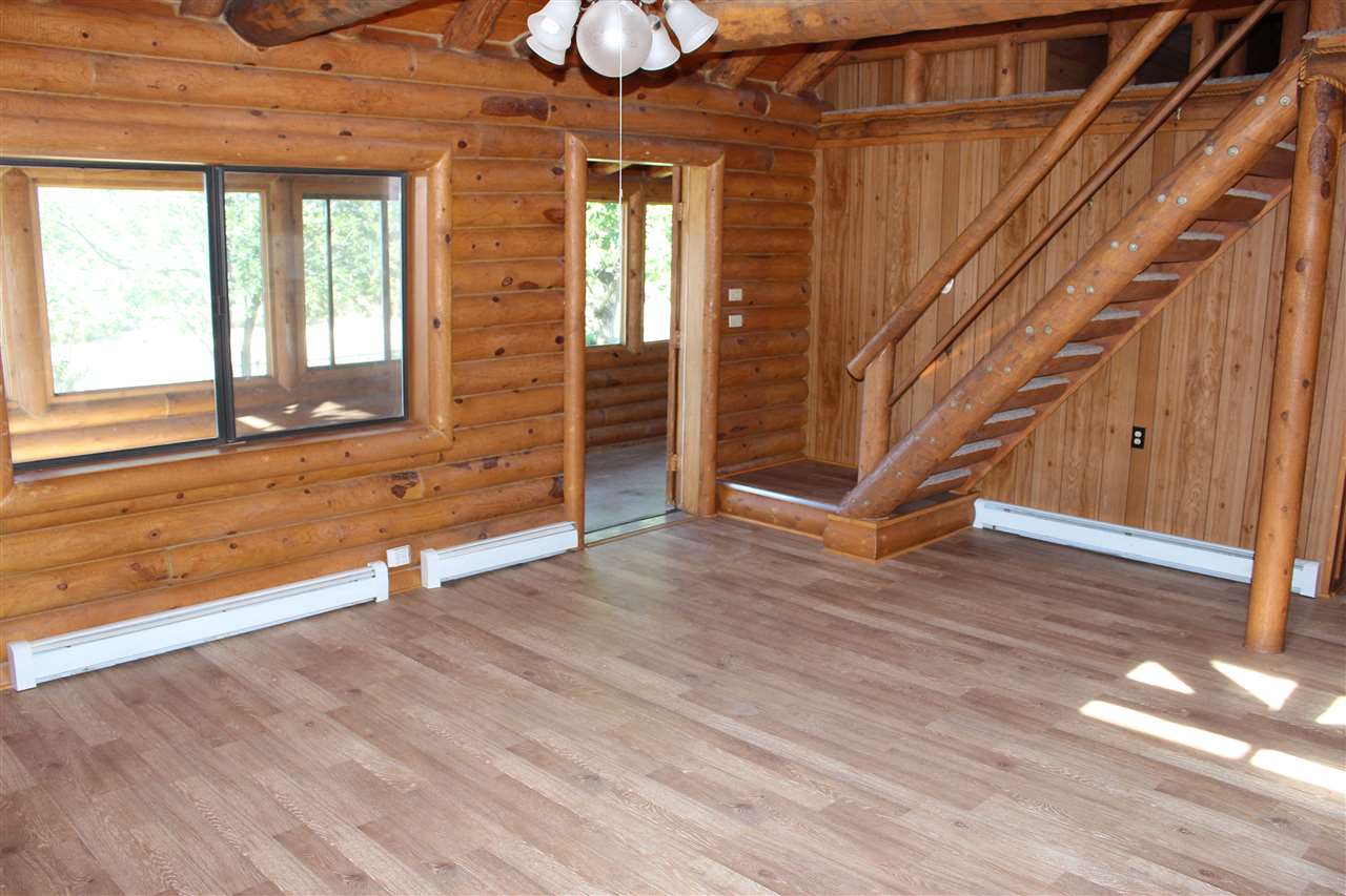 3244 D Road Clifton, CO 81520 - Photo 10 of 21 a view of an empty room with wooden floor and a window