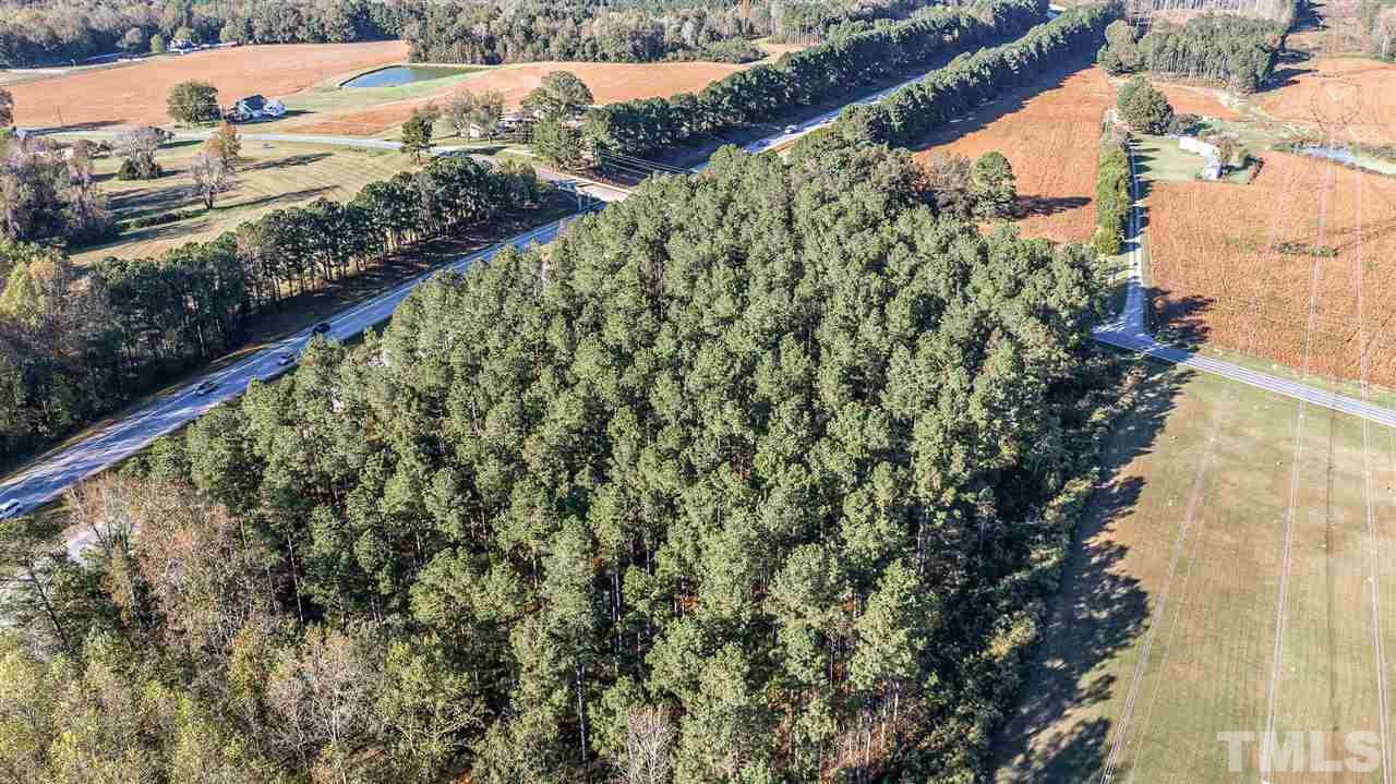 2515 Sanders Road Willow Spring, NC 27592 - Photo 4 of 6 a view of a yard with wooden fence