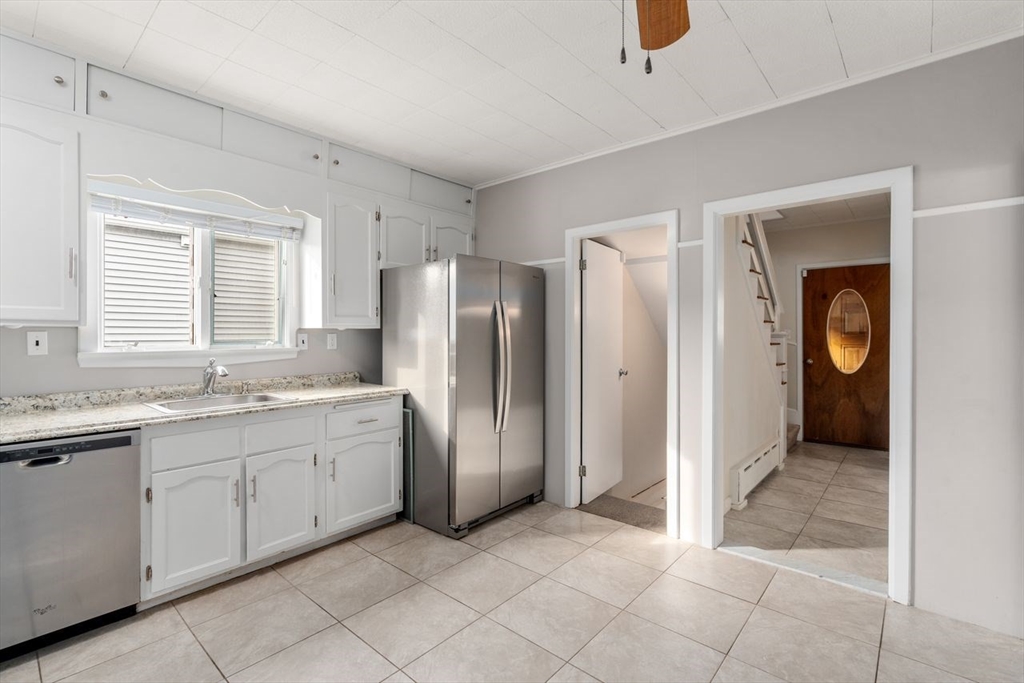 960 Shirley Street Winthrop, MA 02152 - Photo 12 of 38 a bathroom with a granite countertop sink and a mirror