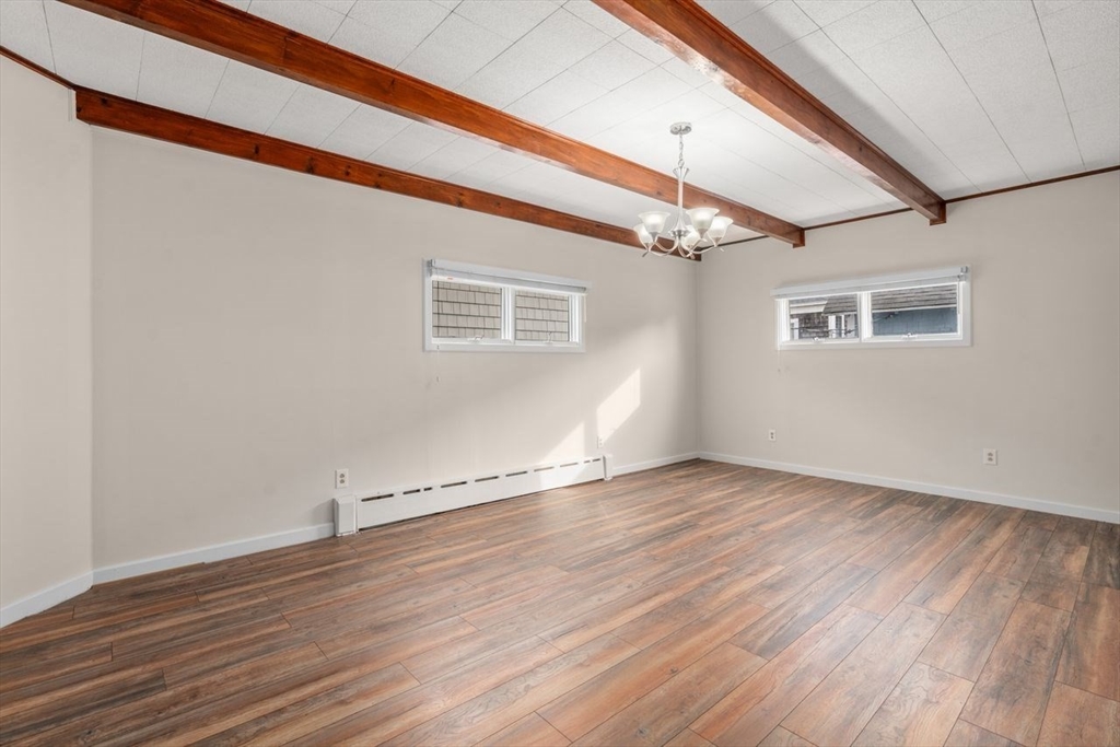 960 Shirley Street Winthrop, MA 02152 - Photo 9 of 38 a view of an empty room with wooden floor and a window