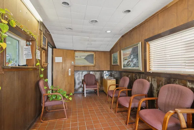 a group of chairs sitting in a room next to a window