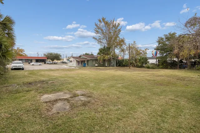 a view of a ocean with a building in the background