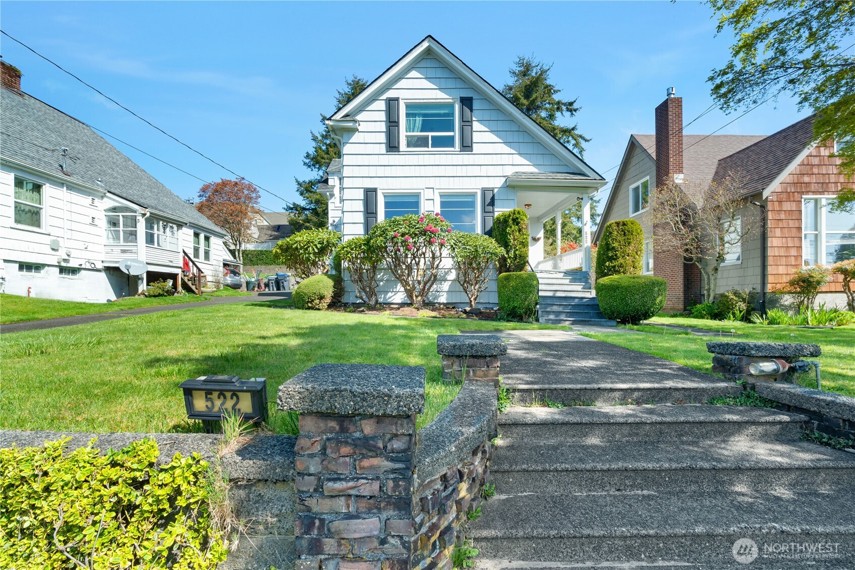 522 West 6th Street Aberdeen, WA 98520 - Photo 1 of 39 a front view of a house with a yard