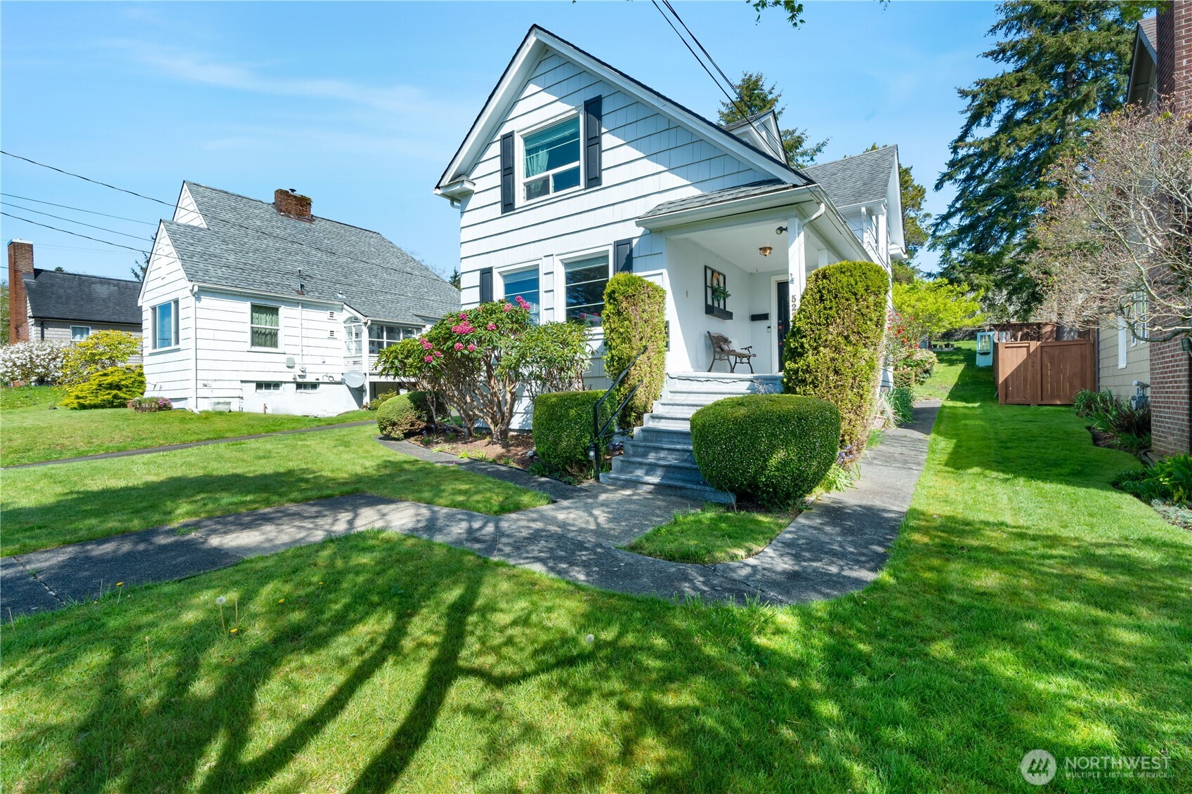 522 West 6th Street Aberdeen, WA 98520 - Photo 2 of 39 a view of a house with a big yard and potted plants