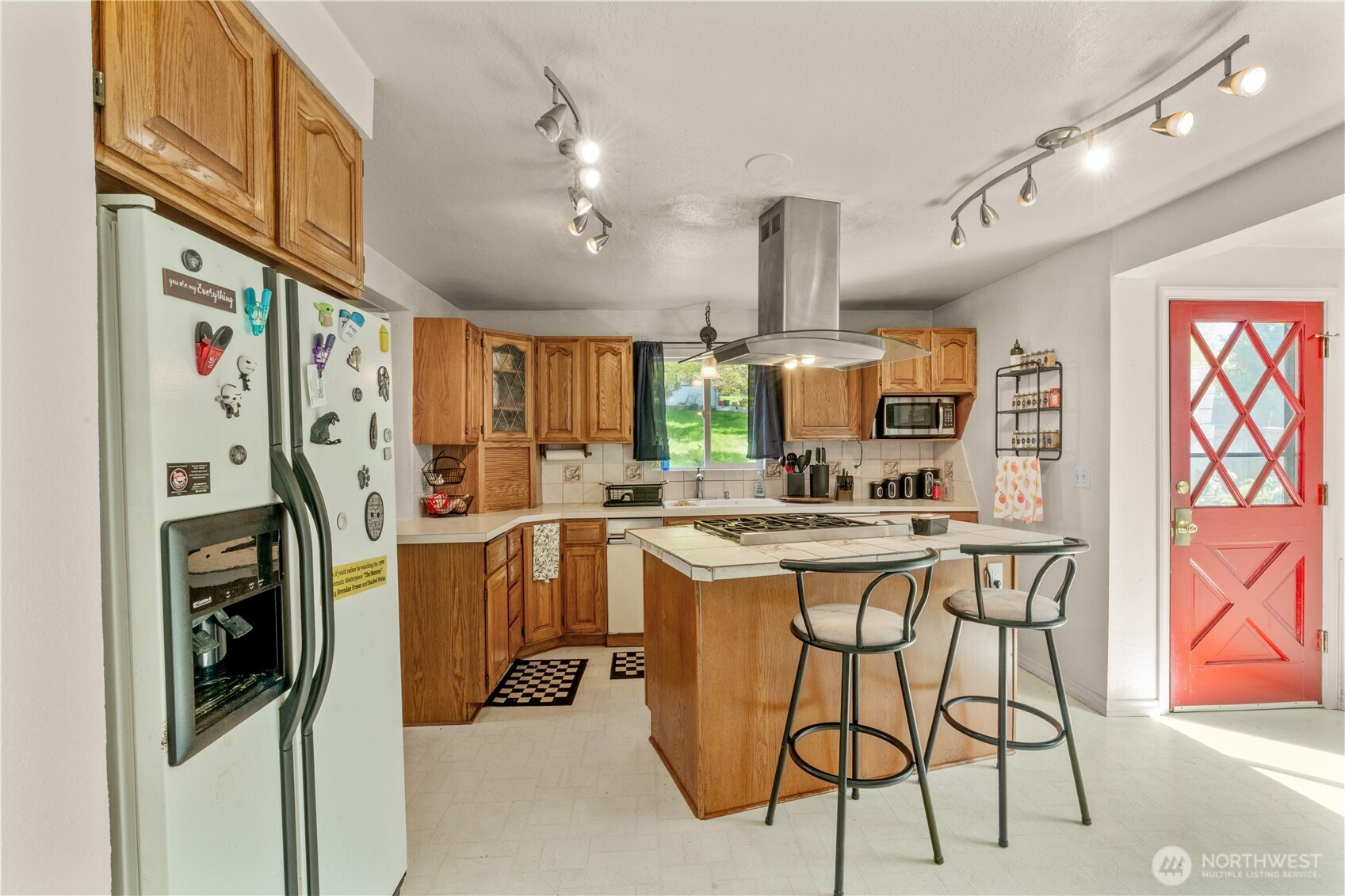 522 West 6th Street Aberdeen, WA 98520 - Photo 9 of 39 a kitchen with stainless steel appliances granite countertop a refrigerator and a stove