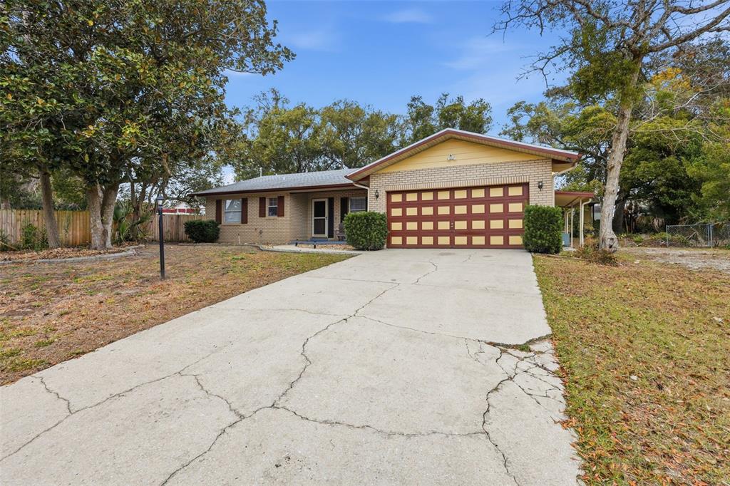 244 Angeles Road DeBary, FL 32713 - Photo 3 of 41 a view of a house with a yard