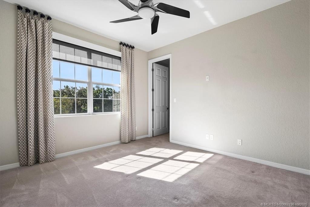 692 Southwest Glen Crest Way Stuart, FL 34997 - Photo 13 of 38 a view of an empty room with a window