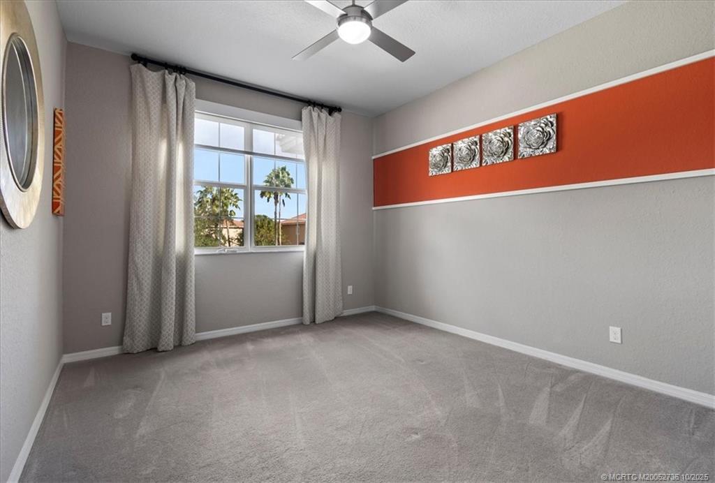 692 Southwest Glen Crest Way Stuart, FL 34997 - Photo 19 of 38 an empty room with windows