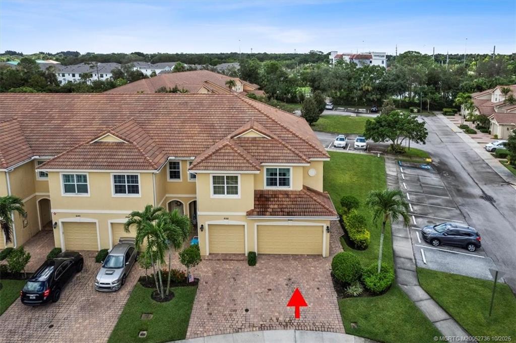 692 Southwest Glen Crest Way Stuart, FL 34997 - Photo 24 of 38 a aerial view of a house with a yard