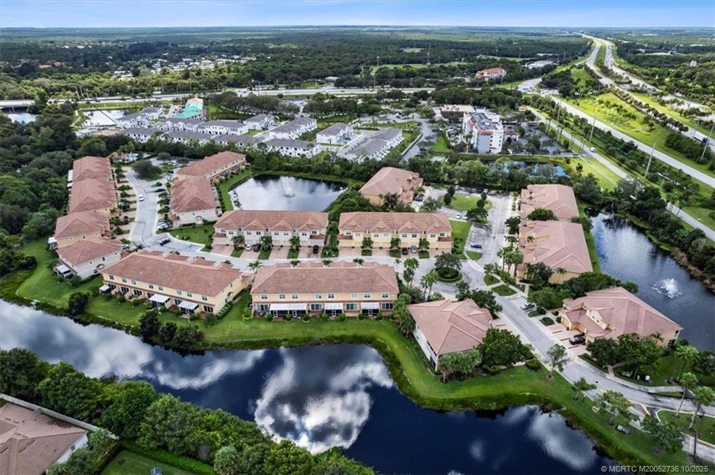 692 Southwest Glen Crest Way Stuart, FL 34997 - Photo 30 of 38 an aerial view of residential houses with outdoor space