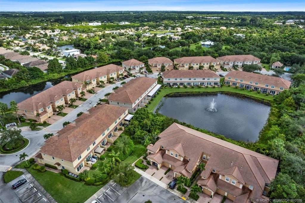 692 Southwest Glen Crest Way Stuart, FL 34997 - Photo 33 of 38 an aerial view of a house with a garden