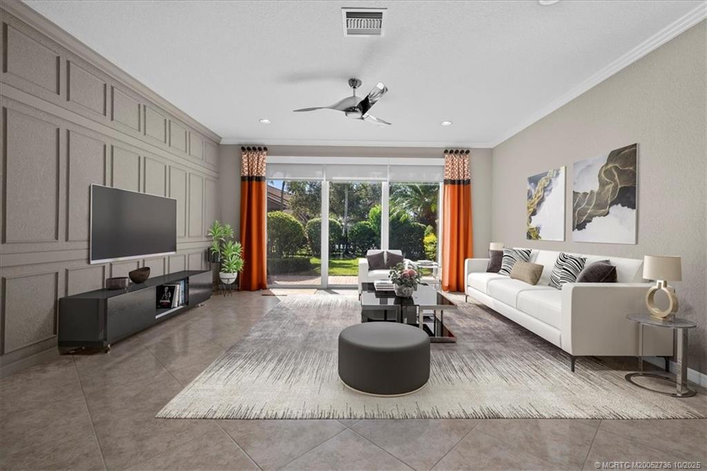 692 Southwest Glen Crest Way Stuart, FL 34997 - Photo 7 of 38 a living room with furniture and a flat screen tv