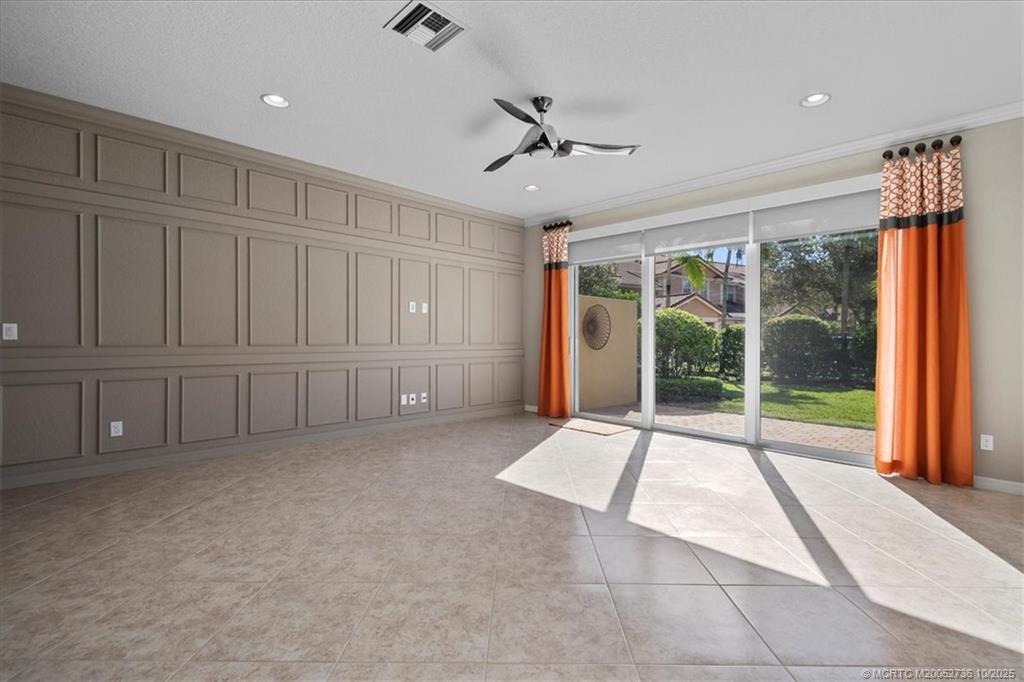 692 Southwest Glen Crest Way Stuart, FL 34997 - Photo 10 of 38 a view of an empty room with a sliding door