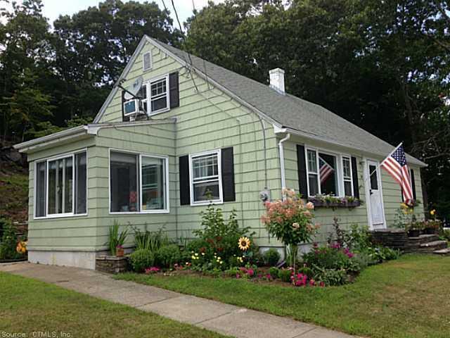 a view of a house with garden and yard