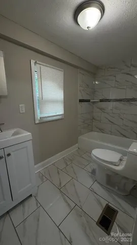 a bathroom with a toilet and a sink