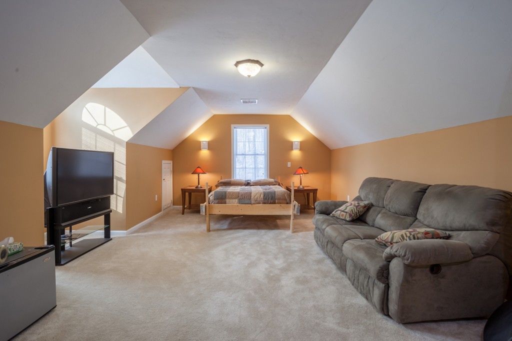 152 Old Worcester Road Charlton, MA 01507 - Photo 19 of 28 a living room with furniture and a flat screen tv
