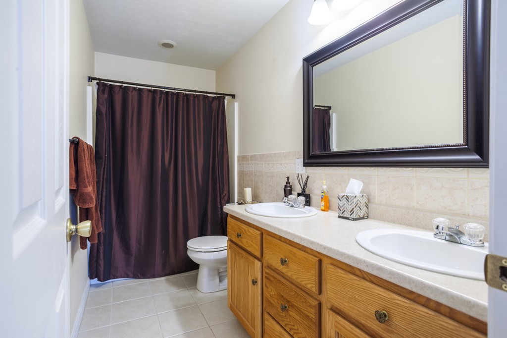 152 Old Worcester Road Charlton, MA 01507 - Photo 20 of 28 a bathroom with a sink a toilet and mirror