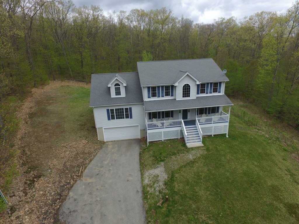 152 Old Worcester Road Charlton, MA 01507 - Photo 26 of 28 a front view of a house with a yard