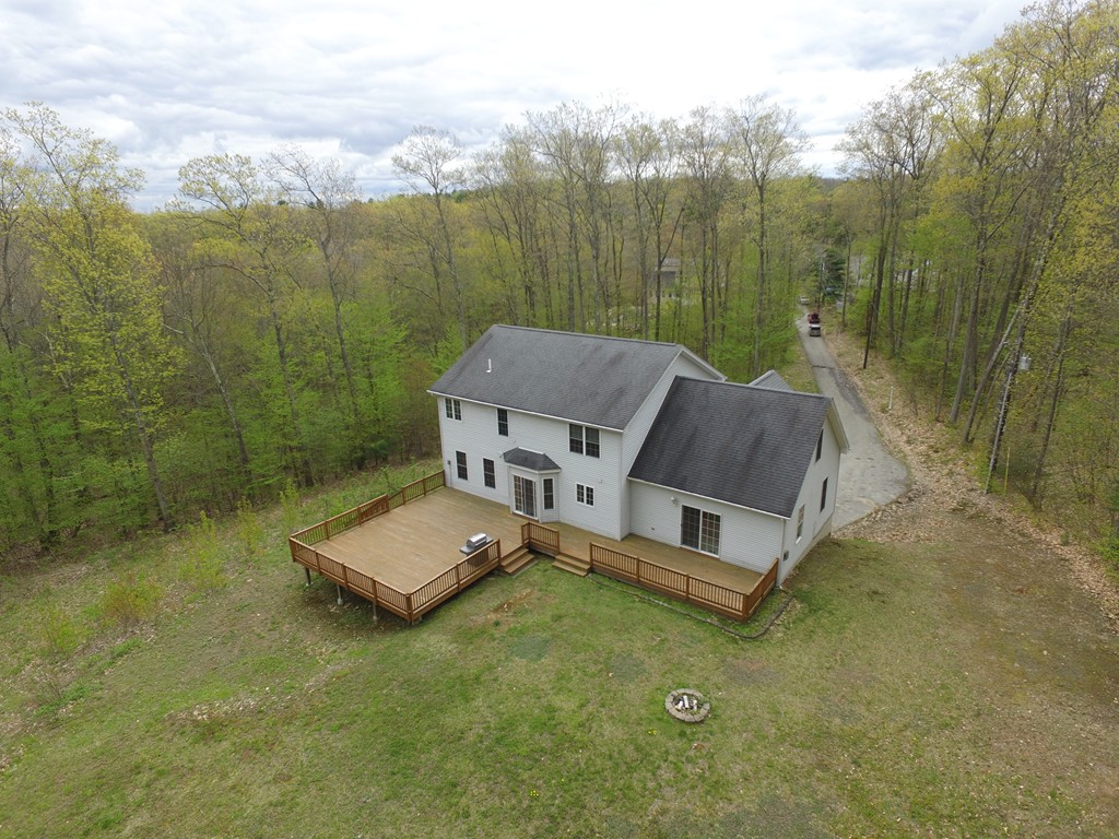 152 Old Worcester Road Charlton, MA 01507 - Photo 27 of 28 a view of a house with a big yard