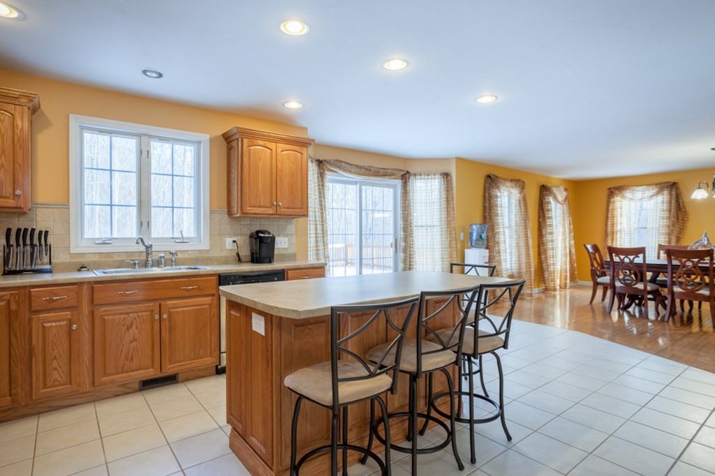 152 Old Worcester Road Charlton, MA 01507 - Photo 5 of 28 a kitchen with a table and chairs in it
