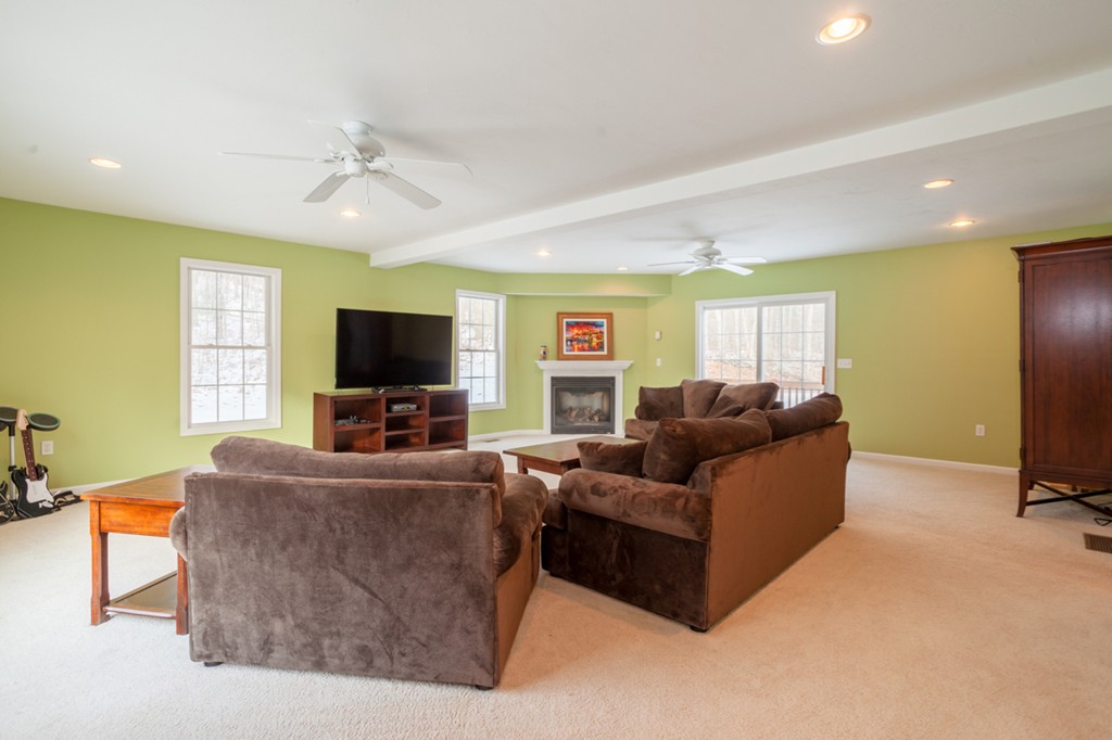 152 Old Worcester Road Charlton, MA 01507 - Photo 9 of 28 a living room with furniture and a flat screen tv
