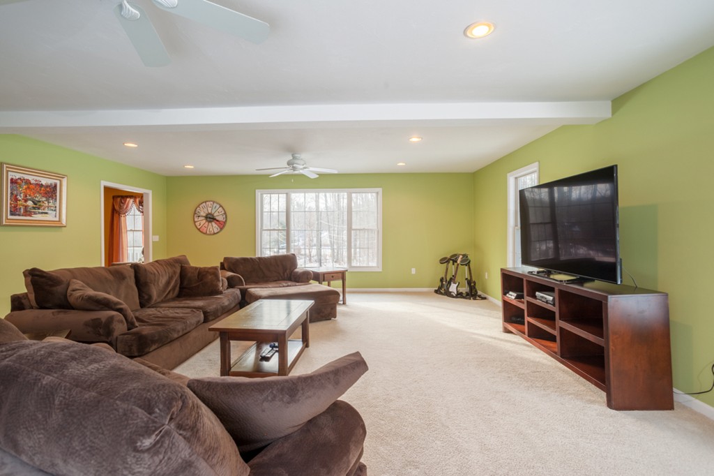 152 Old Worcester Road Charlton, MA 01507 - Photo 10 of 28 a living room with furniture and a flat screen tv