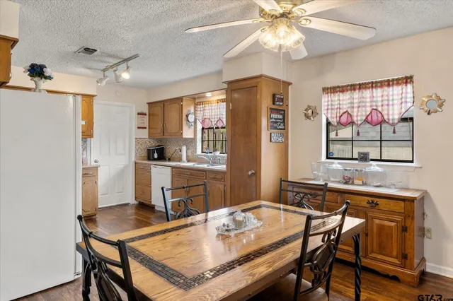 a dining table & chairs in a room